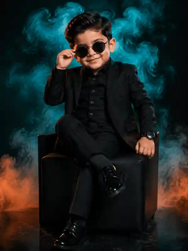 Boy sitting on chair in black suit with smoke background created using gemini prompt for boys