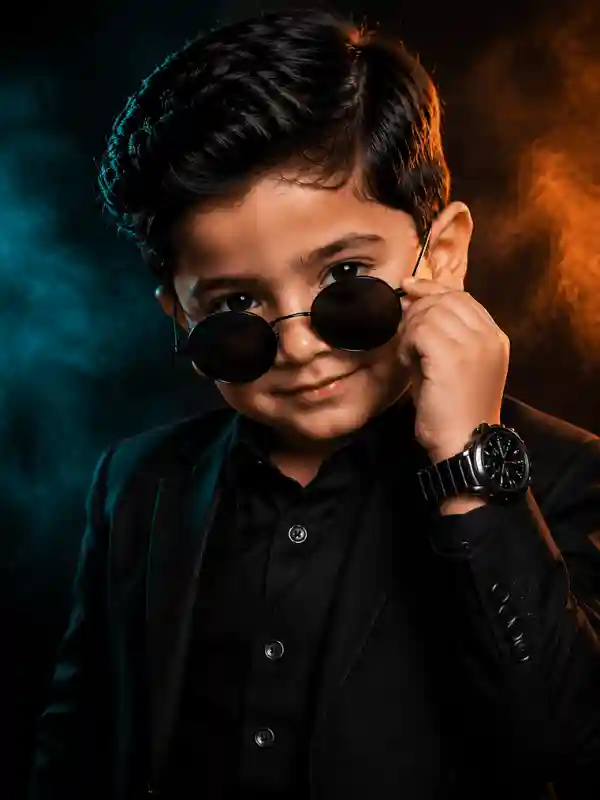 Boy in sunglasses with neon smoke background created using gemini prompt for boys